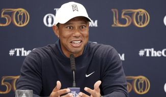 US golfer Tiger Woods speaks during a press conference at the British Open golf championship in St Andrews, Scotland, Tuesday, July 12, 2022. The Open Championship returns to the home of golf on July 14-17, 2022, to celebrate the 150th edition of the sport&#39;s oldest championship, which dates to 1860 and was first played at St. Andrews in 1873. (AP Photo/Peter Morrison)