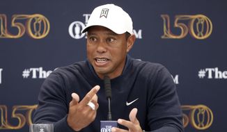 US golfer Tiger Woods speaks during a press conference at the British Open golf championship in St Andrews, Scotland, Tuesday, July 12, 2022. The Open Championship returns to the home of golf on July 14-17, 2022, to celebrate the 150th edition of the sport&#39;s oldest championship, which dates to 1860 and was first played at St. Andrews in 1873. (AP Photo/Peter Morrison)