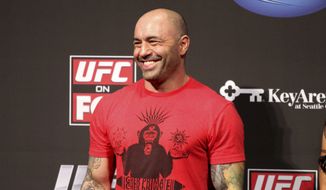 UFC announcer Joe Rogan is seen at the weigh-in before a UFC on FOX 5 event in Seattle, Friday, Dec. 7, 2012. (AP Photo/Gregory Payan) ** FILE **