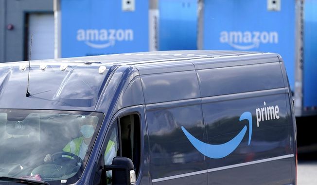 An Amazon Prime logo is seen on the side of a delivery van as it departs an Amazon Warehouse location on Oct. 1, 2020, in Dedham, Mass. Amazon will be offering discounts on a variety of items during its two-day Prime Day shopping event that began Tuesday, July 12, 2022. Consumers are searching for the best deals they can find, including time-sensitive deals that are offered on the site for a short period of time. (AP Photo/Steven Senne, File)