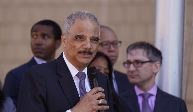 Former U.S. Attorney Gen. Eric H. Holder Jr., who is senior counsel at Covington &amp;amp; Burling, addresses the media, Tuesday, July 12, 2022, in Detroit. (AP Photo/Carlos Osorio) ** FILE **