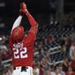 Washington Nationals&#39; Juan Soto gestures after rounding the bases on a solo home run in the ninth inning of the second game of a baseball doubleheader against the Seattle Mariners, Wednesday, July 13, 2022, in Washington. (AP Photo/Patrick Semansky)
