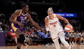 Washington Mystics forward Elena Delle Donne drives against Los Angeles Sparks forward Chiney Ogwumike during the second half of a WNBA basketball game Tuesday, July 12, 2022, in Los Angeles. (Keith Birmingham/The Orange County Register via AP) **FILE**