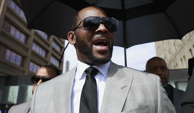 Musician R. Kelly leaves the Leighton Criminal Court building in Chicago on June 6, 2019. The disgraced R&amp;B star has been returned to Chicago to stand trial on federal sex charges weeks after he was sentenced to 30 years in prison for a racketeering and sex trafficking conviction in New York. The 55-year-old Kelly was transferred Tuesday, July 12, 2022, from the federal jail in Brooklyn to the Metropolitan Correctional Center, the Chicago Tribune reported. (AP Photo/Amr Alfiky, File)