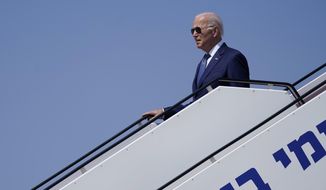 President Joe Biden walks off of Air Force One as he arrives at Ben Gurion Airport, Wednesday, July 13, 2022, in Tel Aviv. (AP Photo/Evan Vucci)