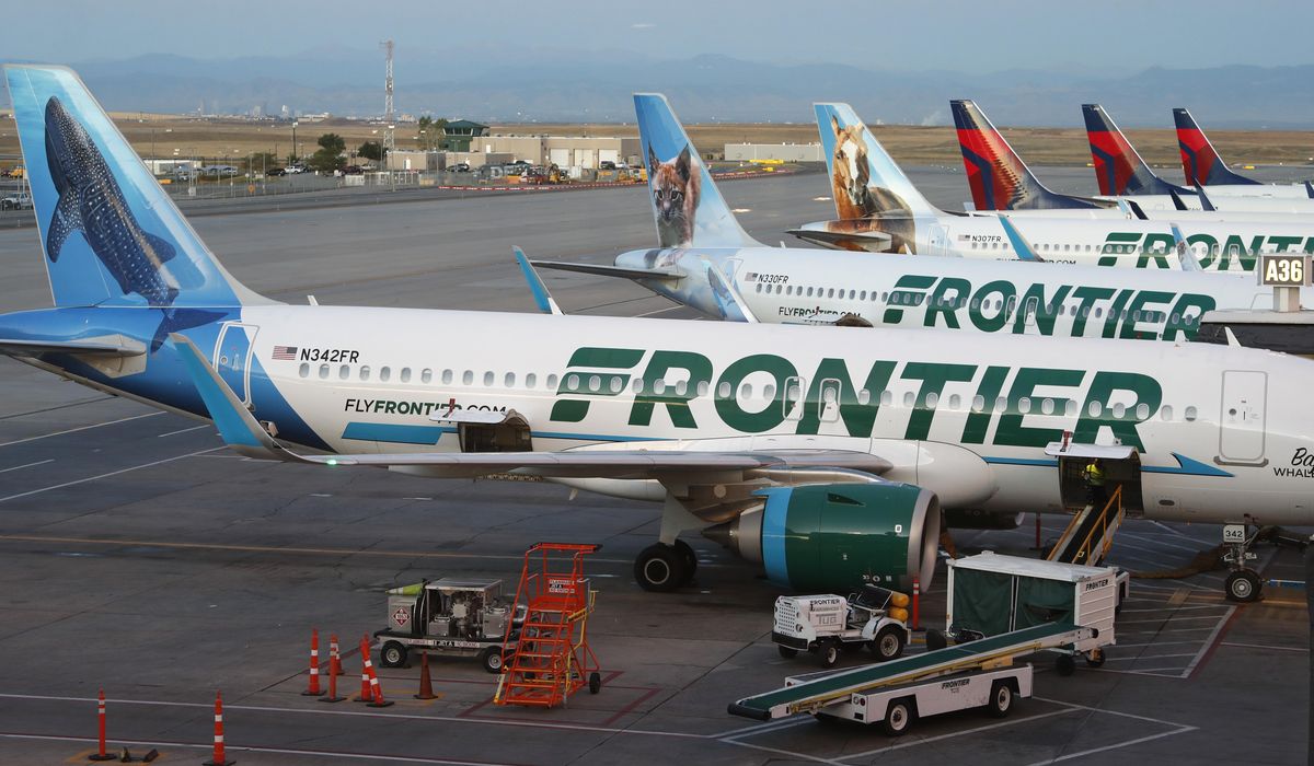 NextImg:Passenger on Frontier Airlines flight restrained by fellow travelers after breaking window