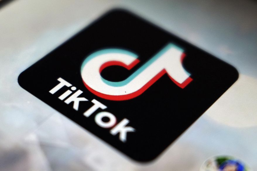 The TikTok app logo appears in Tokyo, on Sept. 28, 2020. A new report says social media platforms like Facebook and TikTok are failing to stop hate and threats against LGBTQ users. (AP Photo/Kiichiro Sato, File)