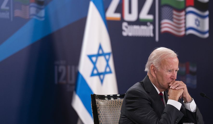 President Joe Biden participates a virtual summit with Israeli Prime Minister Yair Lapid, not seen, and the leaders of India and the United Arab Emirates. It marks the first meeting of the group, known as I2U2, which was established last year to boost economic and technological cooperation between the four countries, in Jerusalem, Thursday, July 14, 2022. (AP Photo/Evan Vucci)