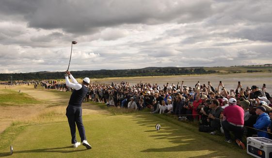 Tiger Woods of the US plays from the 12th tee during the first round of the British Open golf championship on the Old Course at St. Andrews, Scotland, Thursday, July 14, 2022. The Open Championship returns to the home of golf on July 14-17, 2022, to celebrate the 150th edition of the sport&#39;s oldest championship, which dates to 1860 and was first played at St. Andrews in 1873. (AP Photo/Gerald Herbert)