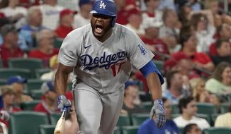 Los Angeles Dodgers&#x27; Hanser Alberto celebrates after hitting an RBI single during the ninth inning of a baseball game against the St. Louis Cardinals Wednesday, July 13, 2022, in St. Louis. (AP Photo/Jeff Roberson)