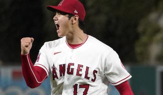 Los Angeles Angels starting pitcher Shohei Ohtani celebrates after striking out Houston Astros&#x27; J.J. Matijevic to end the top of the sixth inning of a baseball game Wednesday, July 13, 2022, in Anaheim, Calif. (AP Photo/Mark J. Terrill)