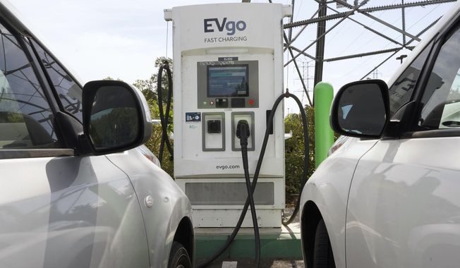 Electric cars are parked at a charging station in Sacramento, Calif., on April 13, 2022. General Motors, Pilot Travel Centers and EVgo said Thursday, July 14, 2022, that they will build 2,000 charging stalls at “up to” 500 Pilot Flying J sites across the nation. GM says construction will start this summer with the first direct current fast chargers operating sometime in 2023. (AP Photo/Rich Pedroncelli, File)