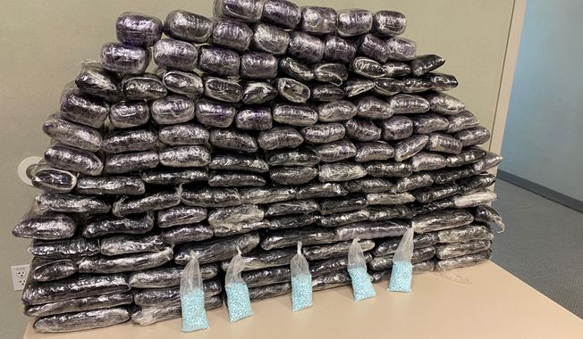 This undated photo provided by the U.S. Drug Enforcement Administration, Los Angeles Field Division, shows some of the fake pills containing fentanyl that were seized when agents served a search warrant, July 5, 2022, at a home in Inglewood, Calif. Overall, the agency seized approximately 1 million fake pills containing fentanyl. (DEA via AP)