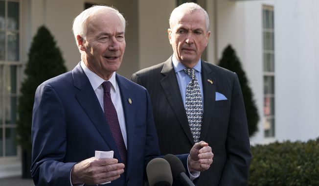 Arkansas Gov. Asa Hutchinson, R-Ark., left, and New Jersey Gov. Phil Murphy, D-N.J., speak with reporters outside during a meeting with the National Governors Association in the East Room of the White House on Jan. 31, 2022, in Washington. The National Governors Association is holding its summer meeting in person for the first time since 2019, after meeting virtually because of the COVID-19 pandemic. The three-day meeting, starting Wednesday, July 13, 2022, in Portland, Maine, follows recent high court rulings overturning Roe v. Wade and striking down gun restrictions by New York. (AP Photo/Alex Brandon, File)