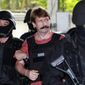 Viktor Bout, center, is led by armed Thai police commandoes as he arrives at the criminal court in Bangkok, Thailand, Tuesday, Oct. 5, 2010. The Russian arms dealer who once inspired a Hollywood movie is back in the headlines with speculation around a return to Moscow in a prisoner exchange for U.S. WBNA star Brittney Griner and former U.S. Marine Paul Whelan. (AP Photo/Apichart Weerawong, File)