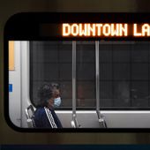 A commuter sits in a Los Angeles Metro train in Los Angeles, Wednesday, July 13, 2022. Los Angeles County, the nation&#x27;s largest by population, is facing a return to a broad indoor mask mandate if current trends in hospital admissions continue, health director Barbara Ferrer told county supervisors Tuesday. (AP Photo/Jae C. Hong)  **FILE**