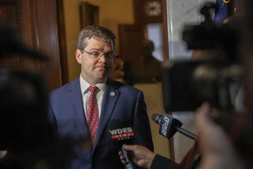 In this file photo, S. Chad Meredith, Kentucky solicitor general, speaks to members of the media after making arguments before the Kentucky Supreme Court at the state Capitol in Frankfort, Ky., on Thursday, June 10, 2021. On Friday, July 15, 2022, the White House dropped plans to nominate Meredith, an anti-abortion lawyer backed by Senate Republican leader Mitch McConnell, for a federal judgeship in Kentucky. (Ryan C. Hermens/Lexington Herald-Leader via AP, Pool, File)  **FILE**