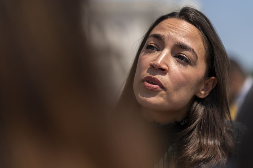 Rep. Alexandria Ocasio-Cortez, D-N.Y., speaks with reporters as she joins female House Democrats at an event ahead of a House vote on the Women&#39;s Health Protection Act and the Ensuring Women&#39;s Right to Reproductive Freedom Act at the Capitol in Washington, Friday, July 15, 2022. (AP Photo/Andrew Harnik)