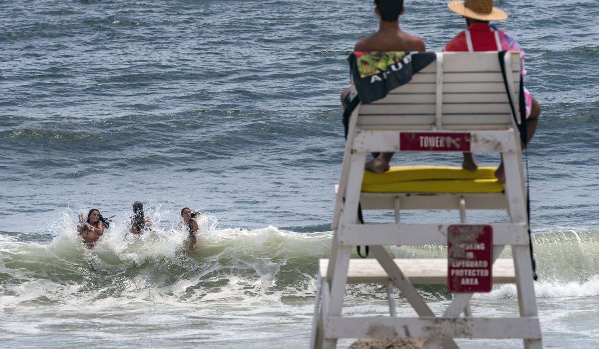 NextImg:Lifeguard shortage threatens summer pool, beach hours