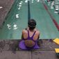 A 12-year-old transgender swimmer waits by a pool on Feb. 22, 2021, in Utah. Utah is asking a judge to dismiss a legal challenge to its ban on transgender kids who want to compete in youth sports. Attorneys for the state argued in July 2022 that two unnamed transgender girls lack standing to challenge the law in court, in part because they haven&#39;t been harmed by it. (AP Photo/Rick Bowmer, File)