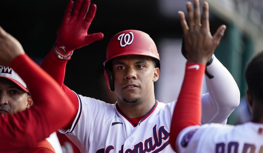 Washington Nationals&#39; Juan Soto celebrates after scoring during the first inning of the team&#39;s baseball game against the Pittsburgh Pirates at Nationals Park, Tuesday, June 28, 2022, in Washington. (AP Photo/Alex Brandon)