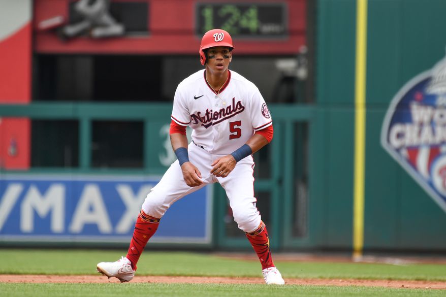 Washington Nationals third baseman Ehire Adrianza (5) taking a lead off first base during the 2nd inning in a game against the Atlanta Braves at Nationals Park in Washington D.C., July 17, 2022. (Photo by All-Pro Reels)