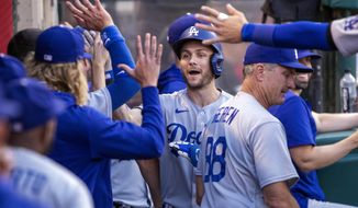 Los Angeles Dodgers&#x27; Trea Turner is congratulated for his solo home run against the Los Angeles Angels during the first inning of a baseball game in Anaheim, Calif., Saturday, July 16, 2022. (AP Photo/Alex Gallardo)