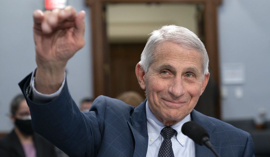 Dr. Anthony Fauci, director of the National Institute of Allergy and Infectious Diseases, waves hello to the committee at the start of a House Committee on Appropriations subcommittee hearing, about the budget request for the National Institutes of Health, May 11, 2022, on Capitol Hill in Washington. (AP Photo/Jacquelyn Martin, File)