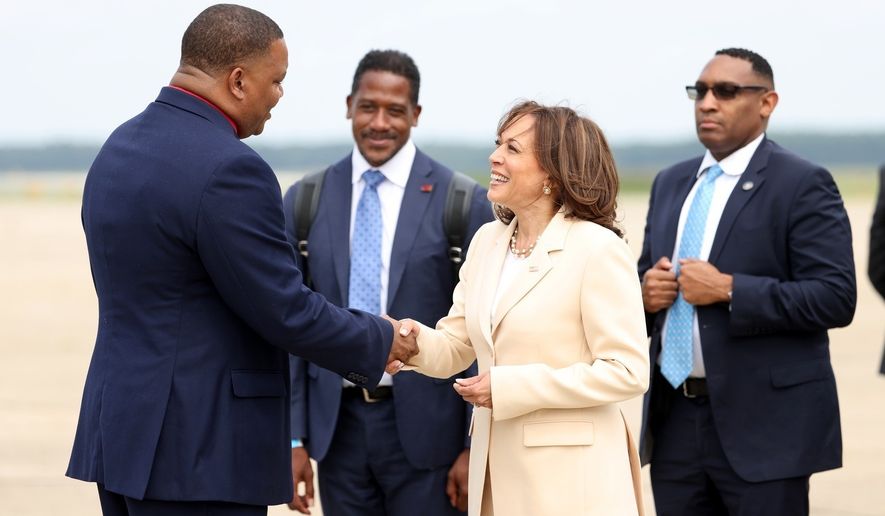 Vice President Kamala Harris is greeted by Atlantic City Mayor Marty Small Sr. at Atlantic City International Airport on Monday, July 18, 2022. Harris is scheduled to address the NAACP&#39;s 113th national convention in Atlantic City. (Tim Hawk/NJ Advance Media via AP)