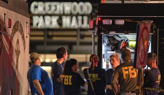 FBI agents gather at the scene of a deadly shooting, Sunday, July 17, 2022, at the Greenwood Park Mall, in Greenwood, Ind. (Kelly Wilkinson/The Indianapolis Star via AP)