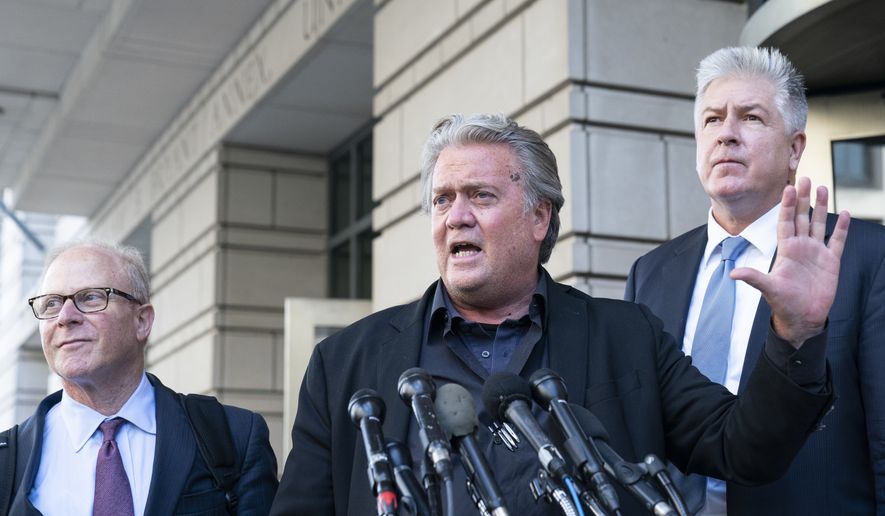 Former White House strategist Steve Bannon, center, speaks with reporters as he departs federal court on Tuesday, July 19, 2022, in Washington. Accompanying Bannon are his attorneys David Schoen, left, and M. Evan Corcoran. Bannon, a one-time adviser to former President Donald Trump, faces criminal contempt of Congress charges after refusing for months to cooperate with the House committee investigating the Jan. 6, 2021, Capitol insurrection. (AP Photo/Alex Brandon)