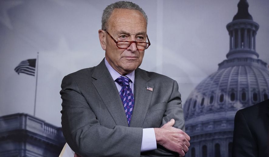 Senate Majority Leader Chuck Schumer, D-N.Y., listens during a news conference following a closed-door caucus lunch, at the Capitol in Washington, Tuesday, July 19, 2022. (AP Photo/J. Scott Applewhite) **FILE**