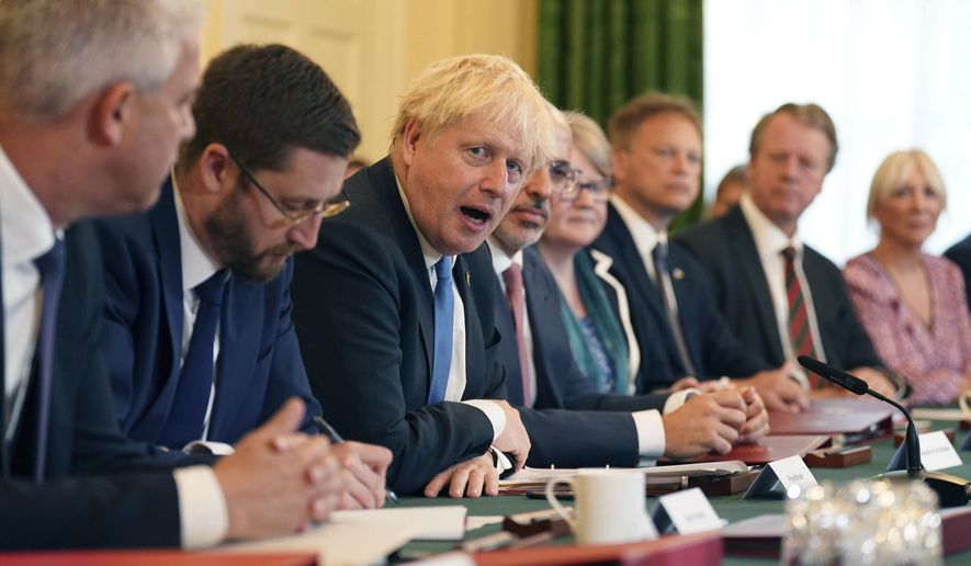 From left, Britain&#39;s Health Secretary Stephen Barclay, Cabinet Secretary and Head of the Civil Service Simon Case, Prime Minister Boris Johnson, Chancellor of the Exchequer Nadhim Zahawi, Work and Pensions Secretary Therese Coffey, Transport Secretary Grant Shapps, Scottish Secretary Alister Jack and Culture Secretary Nadine Dorries take part in a Cabinet meeting at 10 Downing Street, in London, Tuesday July 19, 2022. (Stefan Rousseau/Pool Photo via AP)