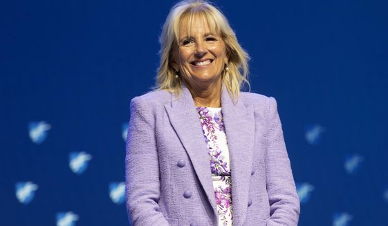 First Lady Jill Biden smiles as she is introduced before speaking during the American Federation of Teachers convention, Friday, July 15, 2022, in Boston. (AP Photo/Michael Dwyer)