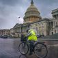 Dark clouds and heavy rain sweep over the U.S. Capitol in Washington, Monday, Aug. 3, 2020, as Tropical Storm Isaias pushes toward the Mid-Atlantic. (AP Photo/J. Scott Applewhite)