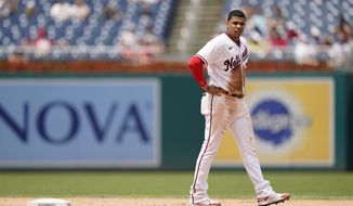 Washington Nationals&#39; Juan Soto walks on the field between innings in the first game of a baseball doubleheader against the Seattle Mariners, Wednesday, July 13, 2022, in Washington. (AP Photo/Patrick Semansky)