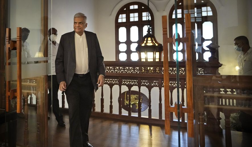 Sri Lanka&#39;s Prime Minister Ranil Wickremesinghe arrives for an interview with The Associated Press in Colombo, Sri Lanka, June 11, 2022. Sri Lankan lawmakers chose Wickremesinghe as president Wednesday, defying the risk the vote would reignite turmoil among a public outraged by the South Asian country&#39;s dire economic, humanitarian and political crisis. (AP Photo/Eranga Jayawardena, File)