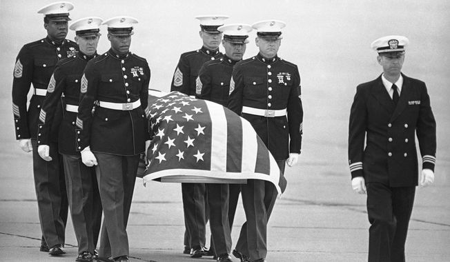 In this March 8, 1985, file photo, U.S. Marine Corps pallbearers carry the casket holding the body of slain U.S. Drug Enforcement agent Enrique Camarena Salazar after it arrived at North Island Naval Air Station, in San Diego. Mexican drug lord Rafael Caro Quintero was only ever sentenced in Mexico for the killing of Camarena and Mexican pilot Alfredo Zavala Avelar in 1985, but his gang apparently killed as many as six U.S. citizens in the western city of Guadalajara around the same time. (AP Photo/Lenny Ignelzi, File)
