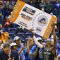 Delaware&#x27;s Jasmine Dickey holds up the March Madness ticket following the second half of an NCAA college basketball championship game against Drexel in the Colonial Athletic Association Conference Tournament, Sunday, March 13, 2022, in Philadelphia. Delaware won 63-59. The NCAA has adequately addressed nine of 23 recommendations for creating comparable NCAA Tournament experiences for men&#x27;s and women&#x27;s basketball players, according to a progress report released Wednesday. July 20, 2022. (AP Photo/Chris Szagola, File) **FILE**