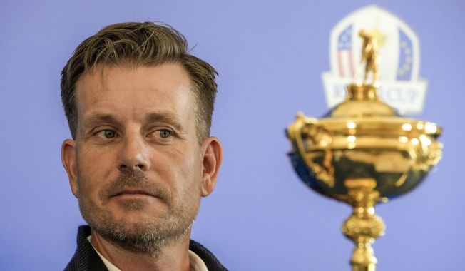 Henrik Stenson looks at the Ryder Cup Trophy during a press conference, at the Marco Simone golf club, in Guidonia Montecelio, outskirts of Rome, Italy, Monday, May 30, 2022.  Stenson was removed as Ryder Cup captain for Europe, Wednesday, July 20, 2022, choosing guaranteed money offered by a Saudi-funded rival league over leading his team in the most celebrated event on the European tour schedule .(AP Photo/Andrew Medichini, File) **FILE**