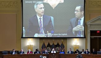 A video show Pat Cipollone, former White House counsel, is played as the House select committee investigating the Jan. 6 attack on the U.S. Capitol holds a hearing at the Capitol in Washington, Thursday, July 21, 2022.(Al Drago/Pool via AP)