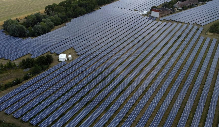 In this file photo, a solar farm is pictured in Wasserleben near Wernigerode at the &#x27;Harz&#x27; mountains, Germany, Thursday, July 21, 2022. (AP Photo/Matthias Schrader)  **FILE**