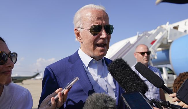 President Joe Biden speaks to members of the media after exiting Air Force One, Wednesday, July 20, 2022, at Andrews Air Force Base, Md. (AP Photo/Evan Vucci)