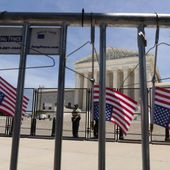 Abortion-rights activists leave hangers on the fence as they protest outside the Supreme Court in Washington on July 4, 2022. (AP Photo/Jose Luis Magana) **FILE**