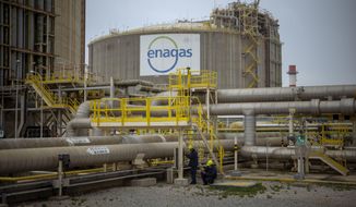 Operators work at the Enagss regasification plant, the largest LNG plant in Europe, in Barcelona, Spain, Tuesday, March 29, 2022. The European Union’s plan to reduce the bloc’s gas use by 15% to prepare for a potential cutoff by Russia this winter has been met with sharp skepticism by Spain and Portugal, two governments that are usually big supporters of the bloc. Madrid and Lisbon on Thursday, July 21, 2022 said they would not support the initiative announced by European Commission Ursula von der Leyen on Wednesday. (AP Photo/Emilio Morenatti, File)