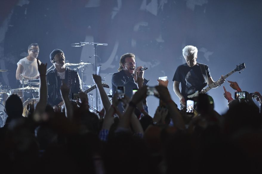 Larry Mullen Jr, left, The Edge, Bono and Adam Clayton of U2 perform during a concert at the Apollo Theater hosted by SiriusXM on June 11, 2018, in New York. (Photo by Evan Agostini/Invision/AP, File)