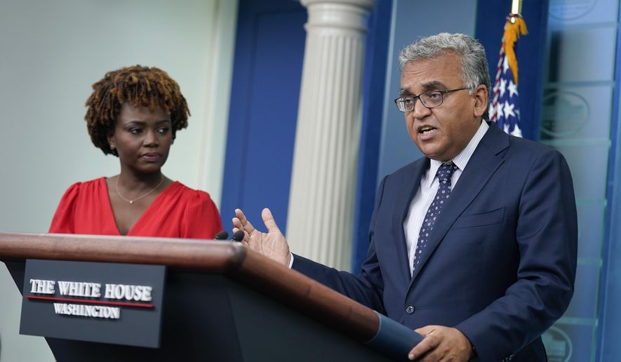 White House Covid Response Coordinator Ashish Jha speaks about President Joe Biden&#39;s positive COVID-19 test during a briefing at the White House, Thursday, July 21, 2022, in Washington. White House press secretary Karine Jean-Pierre listens at left. (AP Photo/Evan Vucci)