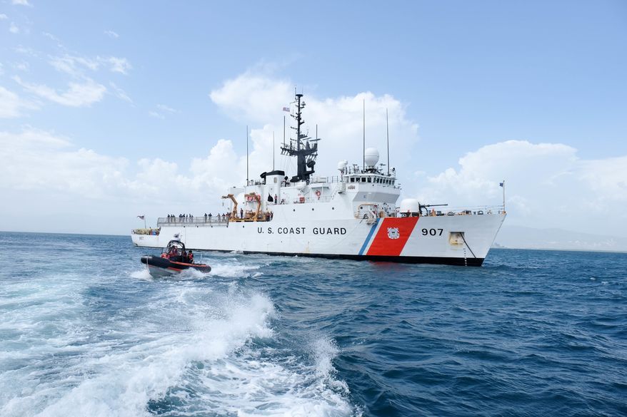 **FILE** Coast Guard Cutter Escanaba. The Coast Guard Cutter Escanaba, a 270-foot medium endurance cutter homeported in Boston, and Escanaba’s small boat are underway for a personnel transfer offshore Haiti Wednesday, July 27, 2016. U.S. Coast Guard photo.