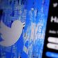 The Twitter splash page is seen on a digital device, Monday, April 25, 2022, in San Diego. Twitter reported a quarterly loss Friday, July 22,  as revenue slipped even as user numbers climbed.  (AP Photo/Gregory Bull)
