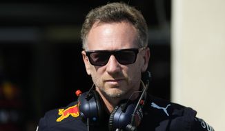 Red Bull racing team principal Christian Horner stands at pit during the second practice for the French Formula One Grand Prix at Paul Ricard racetrack in Le Castellet, southern France, Friday, July 22, 2022. The French Grand Prix will be held on Sunday. (AP Photo/Manu Fernandez)